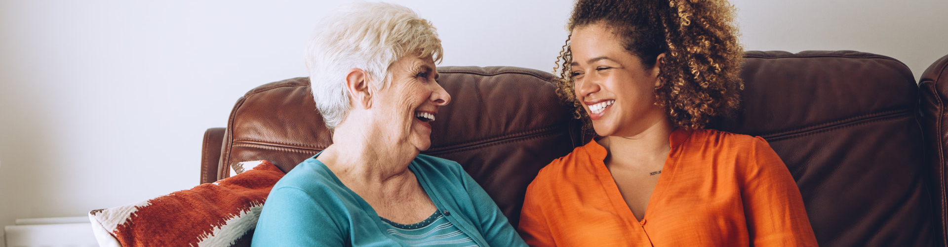 Senior women enjoying a laugh with her caretaker